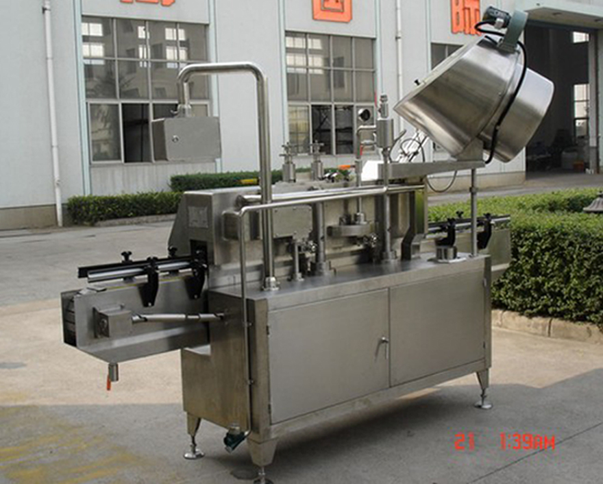 PLC-controlled system glass Jar twist off Steam Capper equipment vacuum capping machine for Glass Jars bakre bild av twist-off vakuumlock.jpg