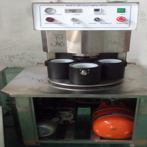 illustration of vacuum capping machine semi automatic illustration för vakuumkapsling.jpg