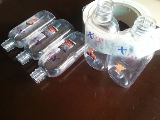 transparent labels labelled samples bottles plane surface Mrwan prov genomskinliga etiketter och flaskor (3).jpg